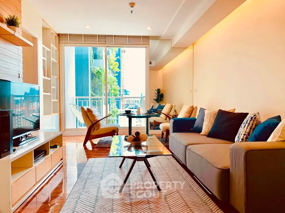 Spacious modern living room with stylish decor and large windows offering natural light.