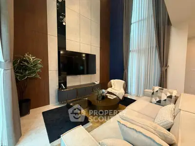 Luxurious living room with high ceilings, elegant decor, and modern furniture in a stylish apartment.