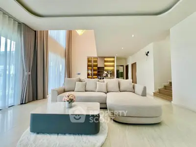 Spacious modern living room with elegant decor and large windows