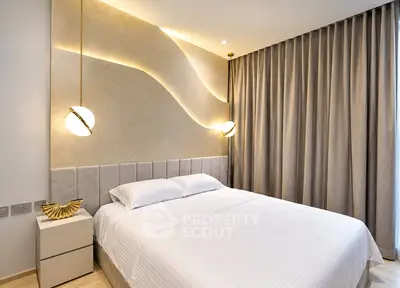 Luxurious modern bedroom with elegant lighting and stylish decor