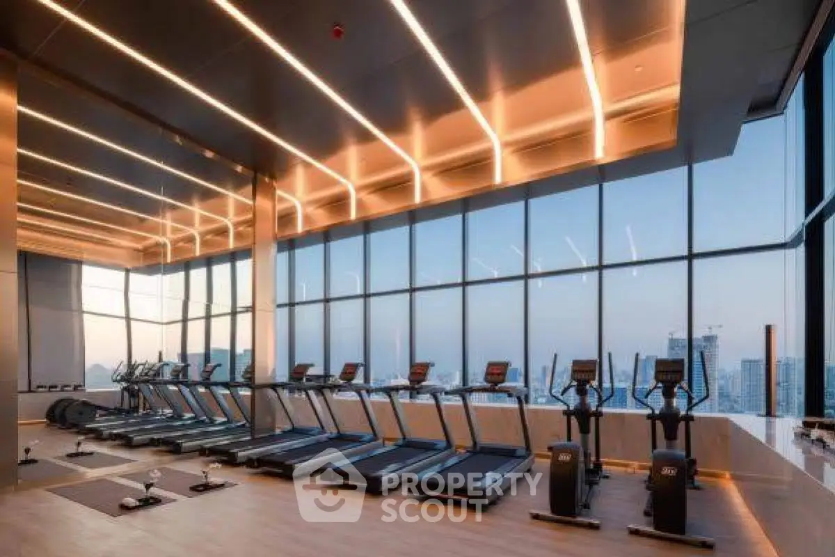 Luxurious high-rise gym with panoramic city views and modern fitness equipment.
