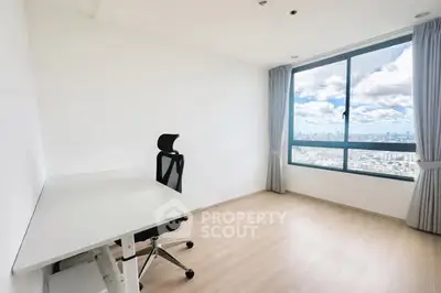 Bright study room with city view and modern desk setup