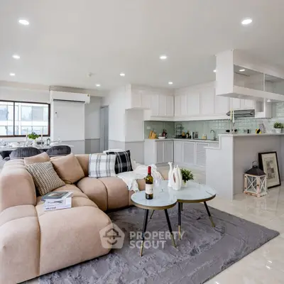 Spacious modern living room with open kitchen and elegant decor