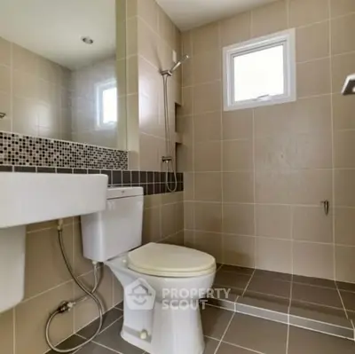 Modern bathroom with sleek design and tiled shower area