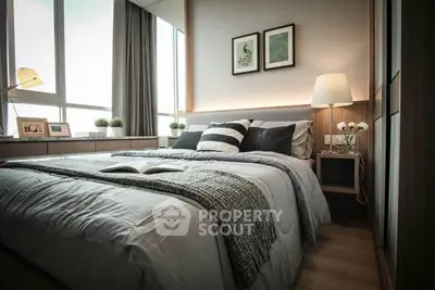Cozy bedroom with large bed, stylish bedding, and modern decor, complemented by natural light from the window, perfect for relaxation.