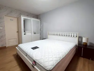 Spacious bedroom with modern design and large wardrobe