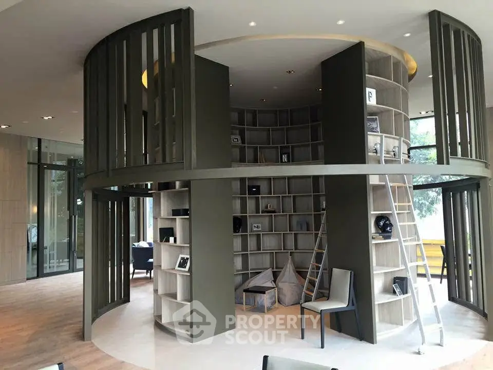 Modern library with circular design and stylish shelving in a contemporary building.
