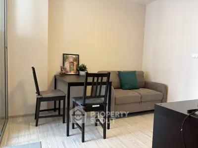 Cozy living room with modern furniture and natural light, perfect for relaxation and entertaining.