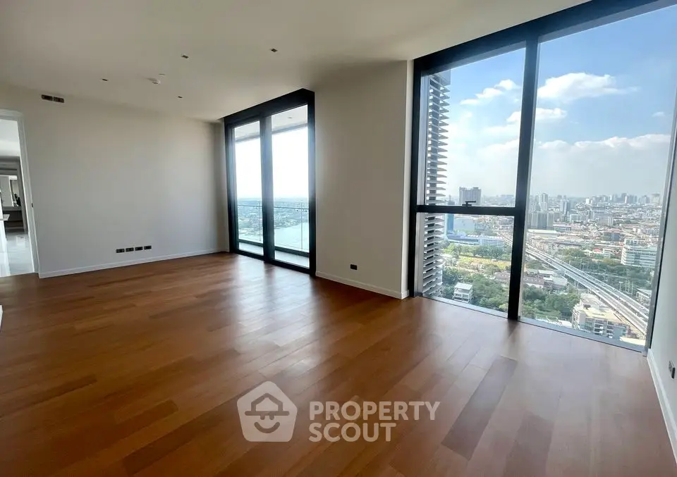 Spacious modern living room with stunning city view and large windows