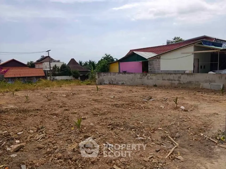 Vacant land plot in a residential area with potential for development.