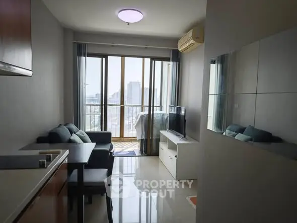 Modern living room with balcony view in high-rise apartment