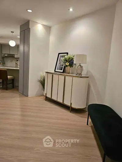 Modern living room with elegant decor and open kitchen layout