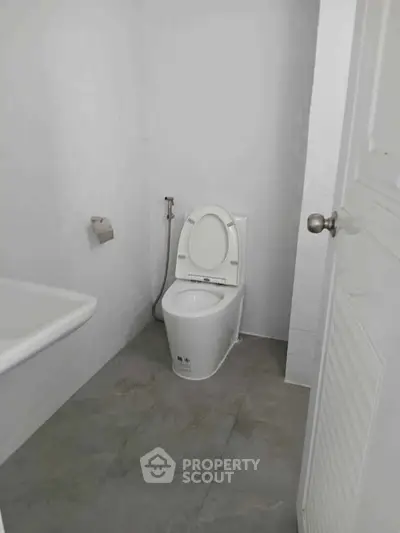 Compact bathroom with modern toilet and minimalistic design