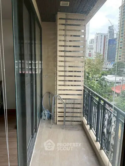 Charming urban balcony with city view, perfect for relaxation and enjoying the skyline.