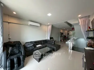 Spacious modern living room with sleek furniture and bright lighting