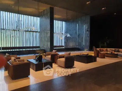 Luxurious spacious living room with modern furniture, elegant marble floors, and large windows offering ample natural light.
