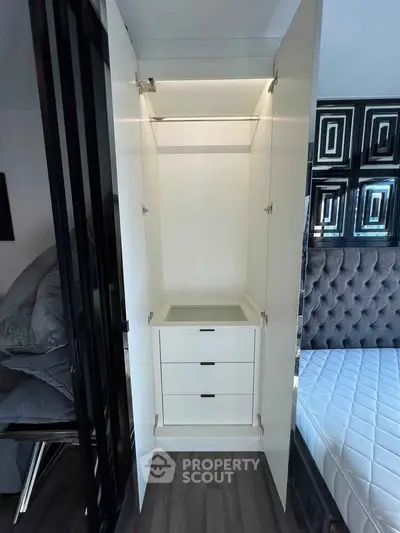 Modern bedroom with sleek built-in wardrobe and stylish decor