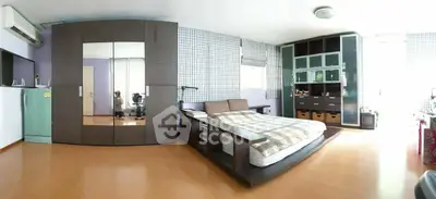 Spacious modern bedroom with stylish furniture and ample storage
