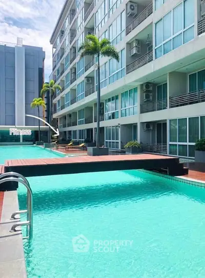 Luxurious apartment complex with stunning pool and fitness center