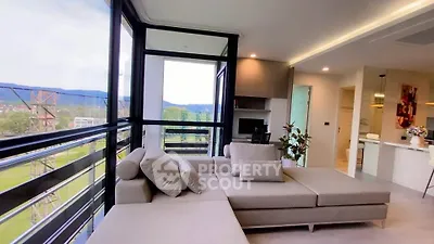 Spacious living room with panoramic windows and modern decor