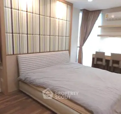 Modern bedroom with stylish decor and natural light