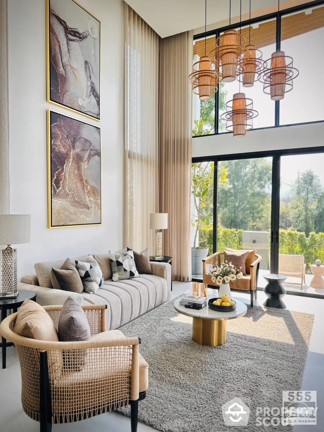 Luxurious living room with high ceiling, elegant decor, and abundant natural light, featuring stylish furniture and modern art pieces.