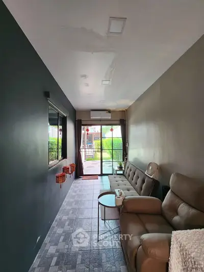 Cozy living room with modern sofa and large window view