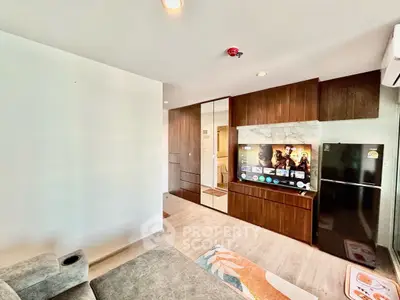 Modern living room with sleek furniture and entertainment center