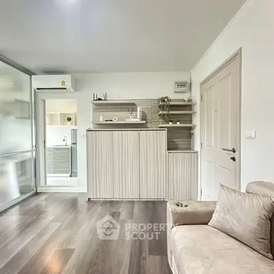 Modern living room with sleek wooden flooring and minimalist decor