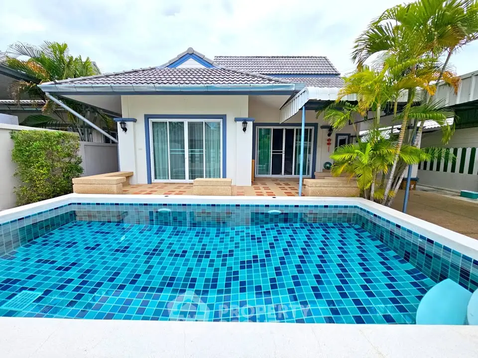 Charming villa with private pool and lush greenery, perfect for relaxation and leisure.