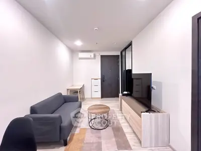 Modern living room with sleek furniture and neutral tones, perfect for urban living.