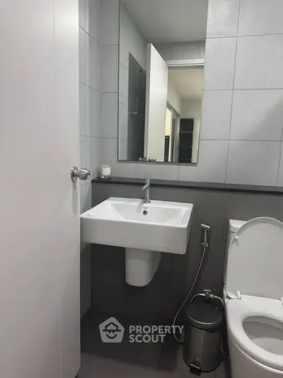 Modern bathroom with sleek fixtures and minimalist design.