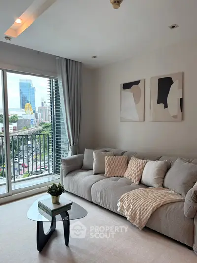 Modern living room with cozy sofa and city view balcony