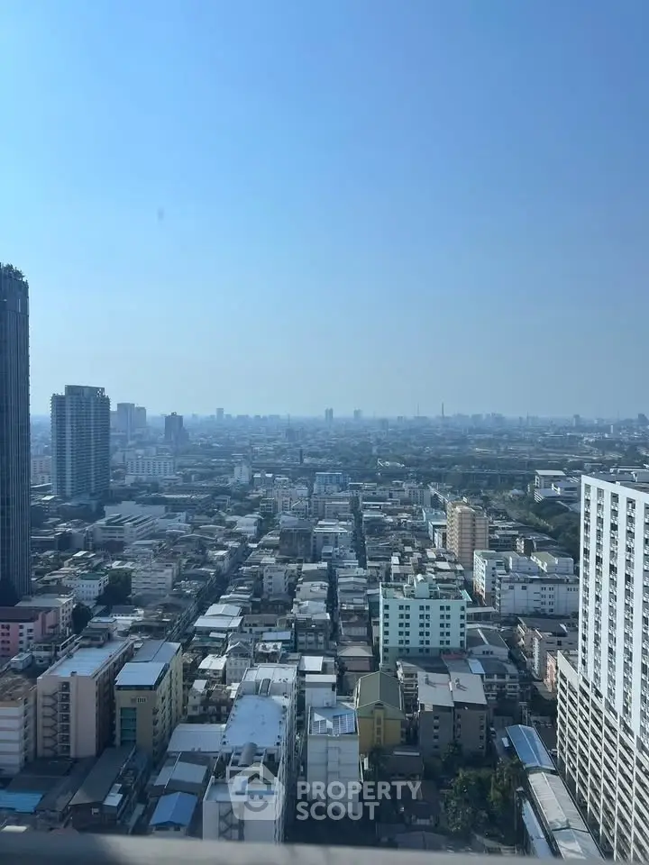 Stunning cityscape view from high-rise building showcasing urban skyline and architecture.