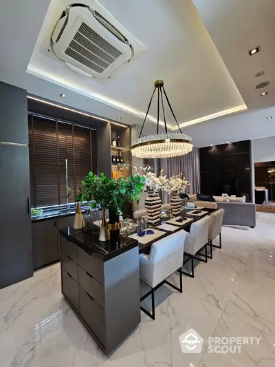 Luxurious modern dining area with elegant chandelier and marble flooring