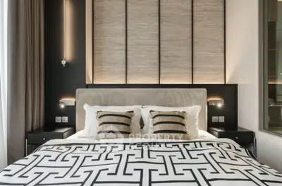 Luxurious modern bedroom with stylish decor and elegant lighting, perfect for a serene retreat.