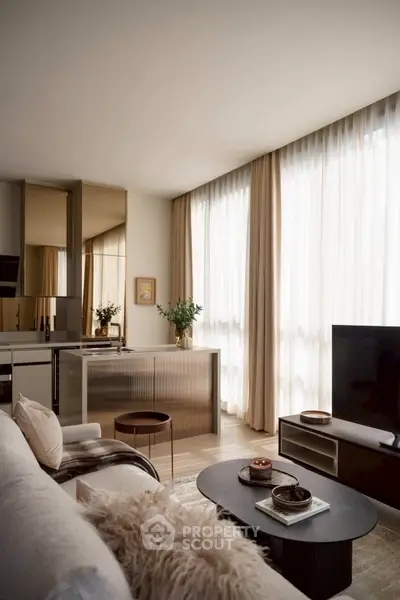 Elegant modern living room with large windows and stylish decor in a luxury apartment.