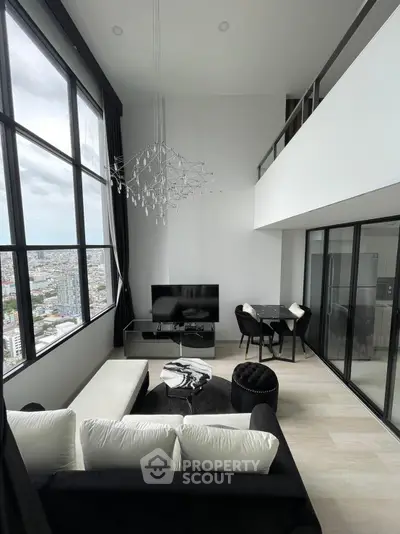 Stunning modern living room with high ceilings and panoramic city views, featuring elegant black and white decor.