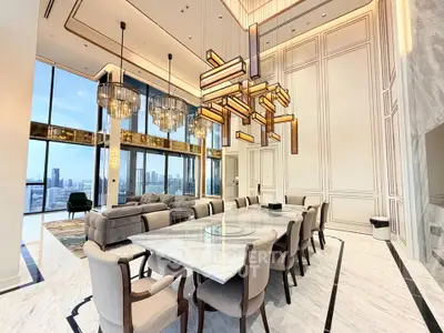 Luxurious high-ceiling living room with modern chandelier and city view
