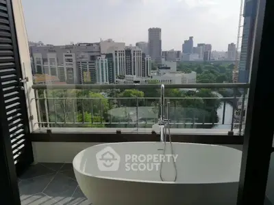 Luxurious balcony with bathtub offering stunning cityscape views