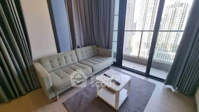 Modern living room with city view and balcony access in high-rise apartment