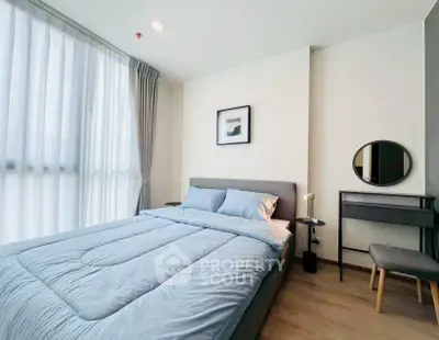 Modern bedroom with cozy bed and stylish decor in a bright apartment