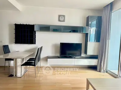 Modern living room with sleek furniture and large window for natural light