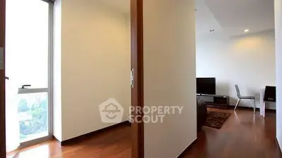 Modern apartment interior with wooden flooring and natural light