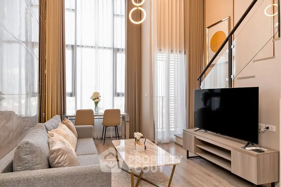Luxurious modern living room with high ceilings and elegant decor