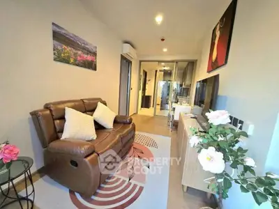 Modern living room with cozy leather sofa and stylish decor in a contemporary apartment.