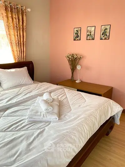 Cozy bedroom with soft lighting and elegant decor, perfect for relaxation.