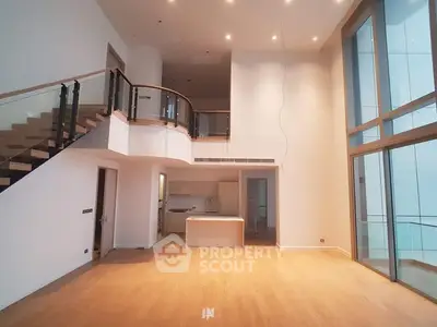 Luxurious modern living room with high ceilings and mezzanine in upscale apartment