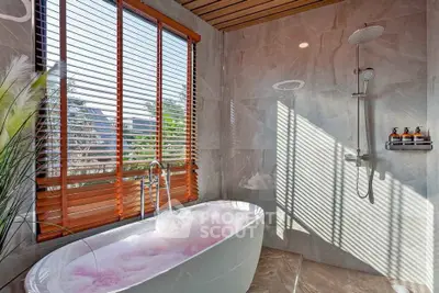Luxurious bathroom with freestanding bathtub and modern shower
