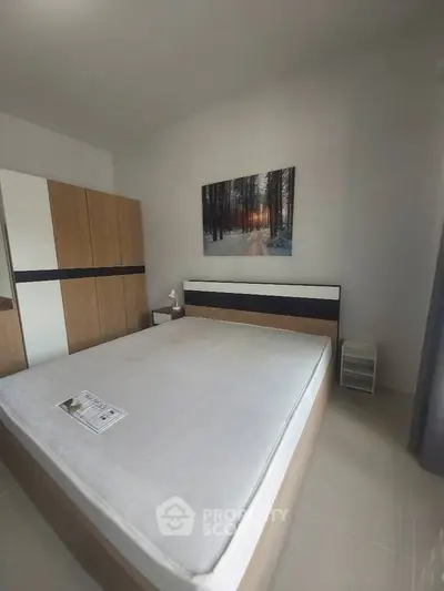 Spacious bedroom with modern decor and large wardrobe